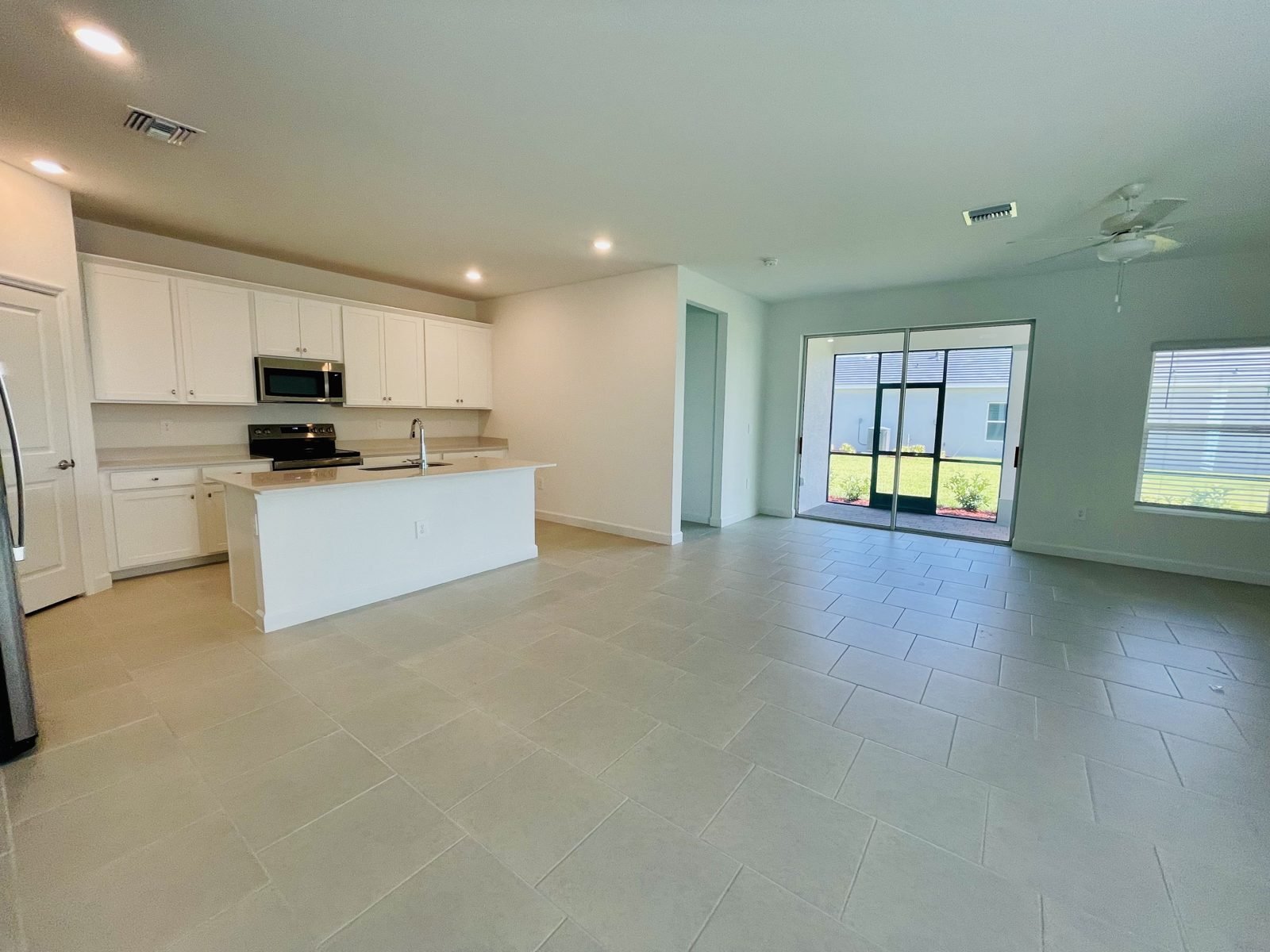Tile flooring throughout the Carson open floor plan at Hampton Lakes