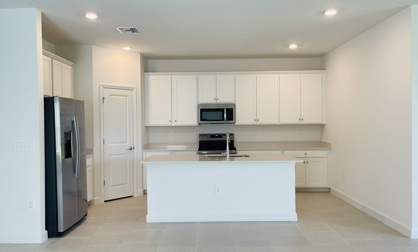 Included white quartz countertops and shaker cabinets in a Lennar Carson home at Hampton Lakes