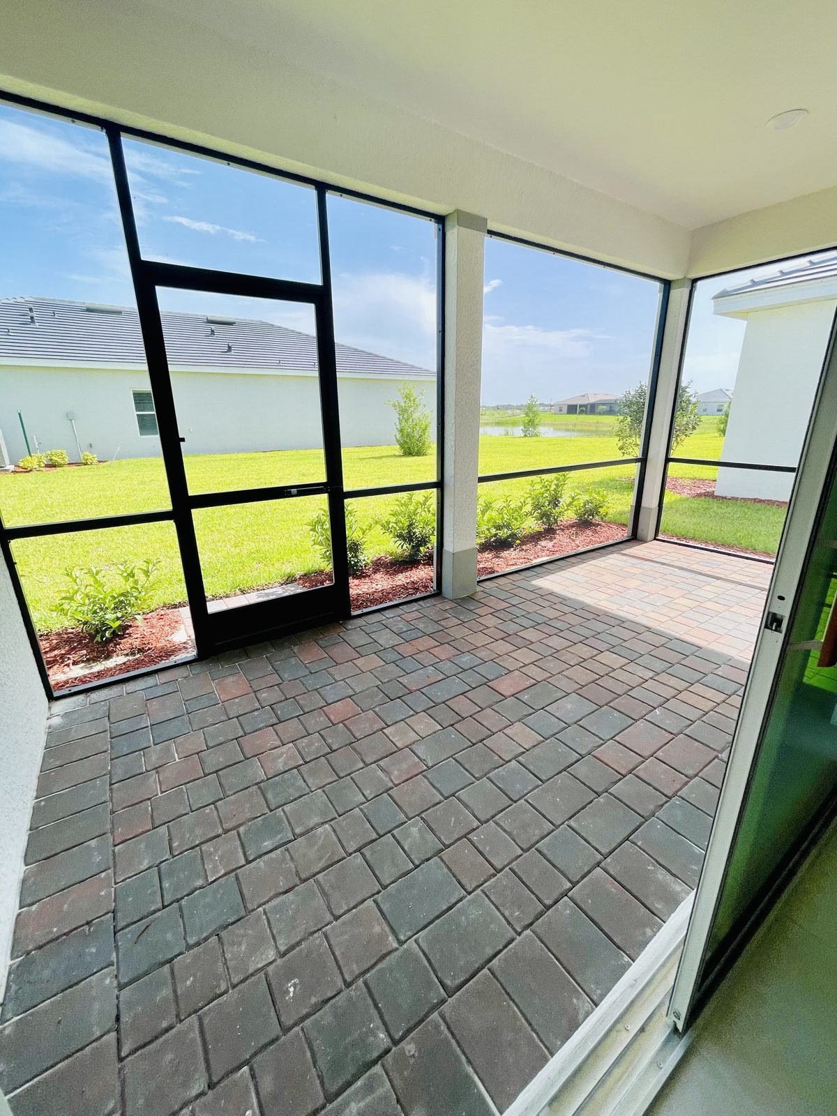 Red brick paver screened patio on the featured Carson home
