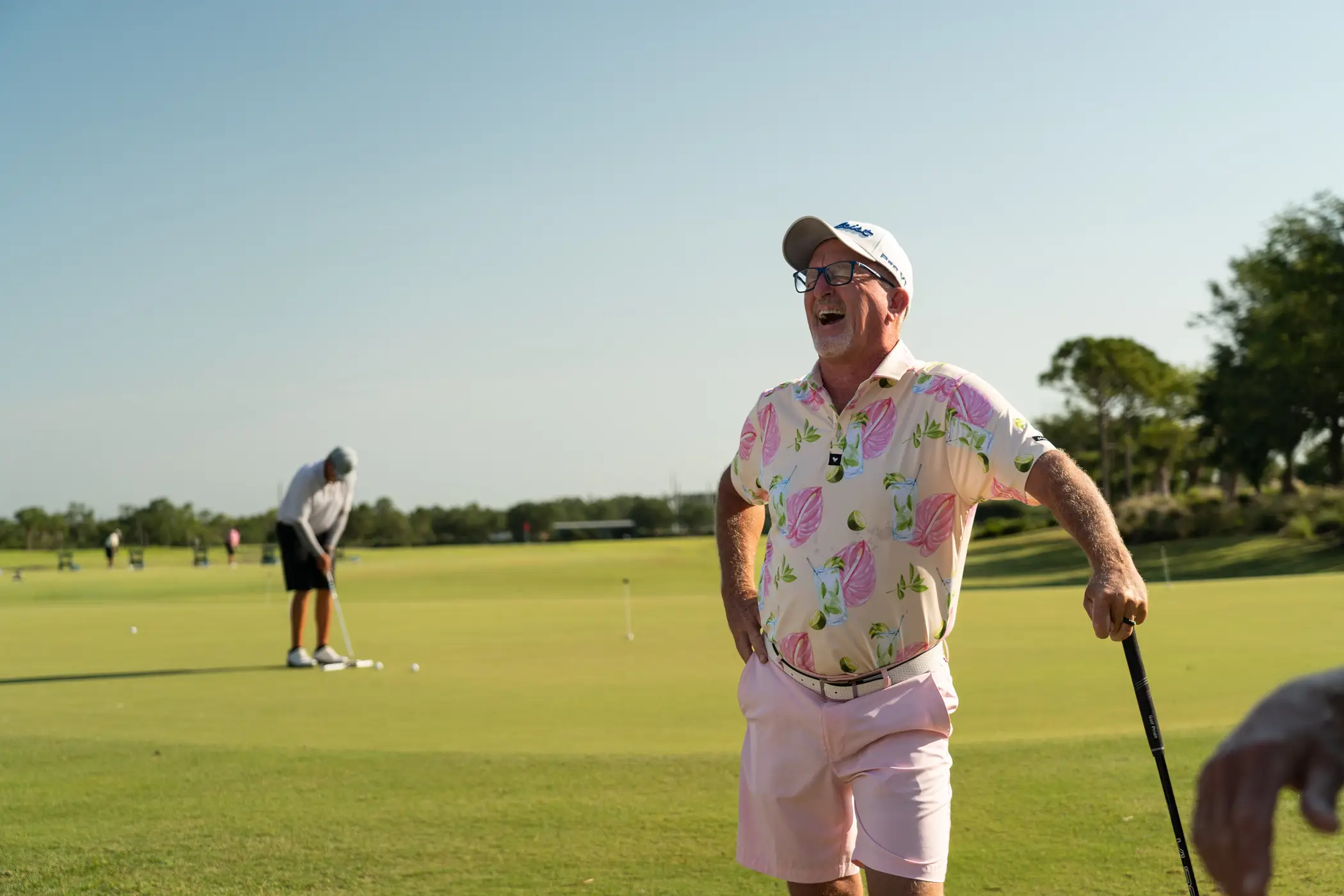 Golfers celebrating a putt on the River Hall course